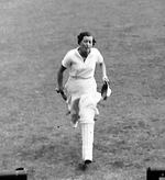 Myrtle Maclagan returns to the pavilion after making 115