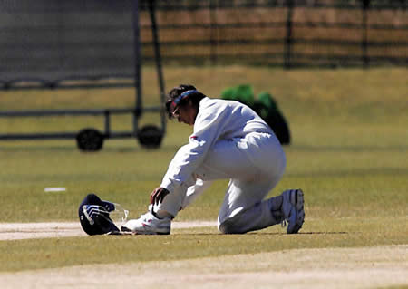 Purnima Rau putting-on a shin guard